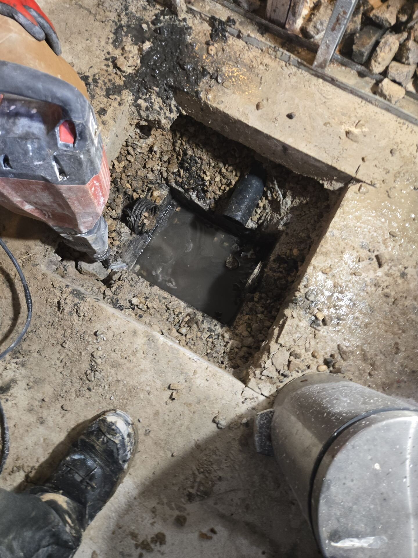 Main drain dug out under a basement floor
