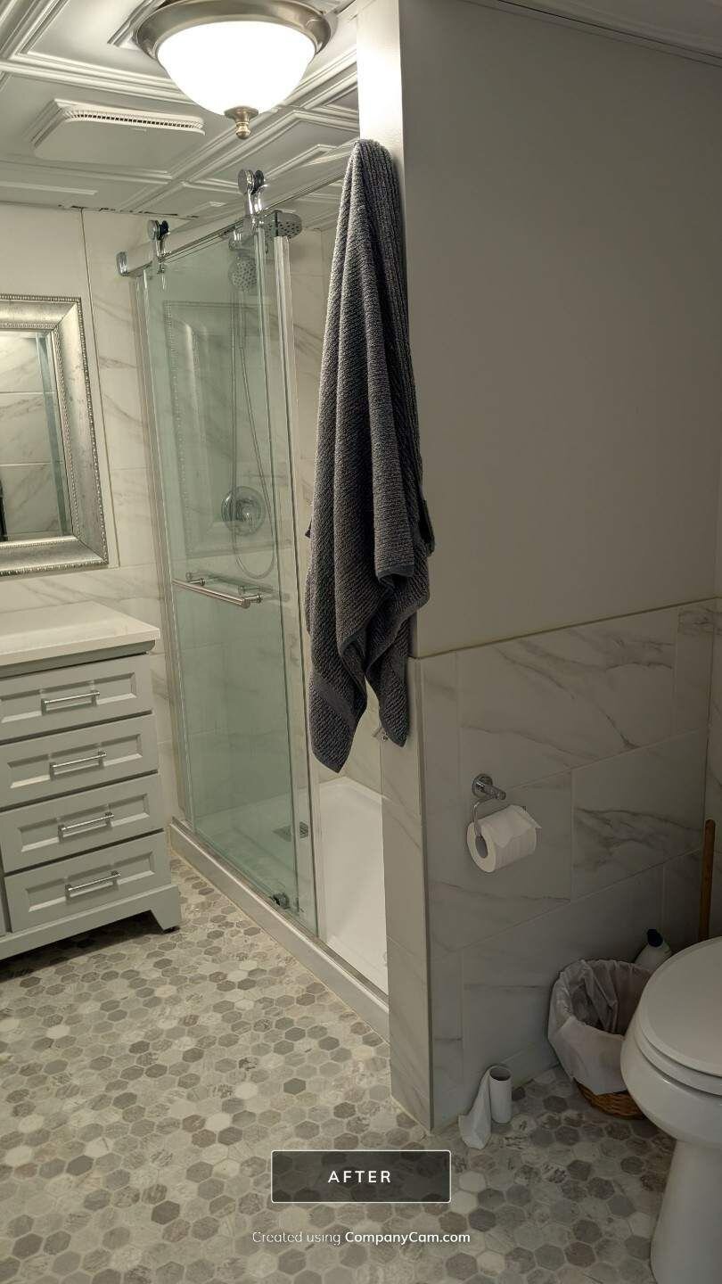 Finished bathroom renovation with glass shower | Renovation plumbing, Kitchener-Waterloo Finished renovated bathroom with a glass shower and vanity – renovation plumbing, Einwechter Plumbing & Heating, Kitchener-Waterloo