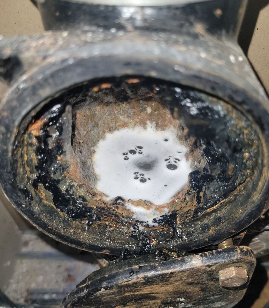 Grease-clogged drain stack | Drain cleaning and hydro jetting, Kitchener-Waterloo Drain stack opened at the cleanout, packed with grease and buildup before drain cleaning, Einwechter Plumbing & Heating, Kitchener-Waterloo