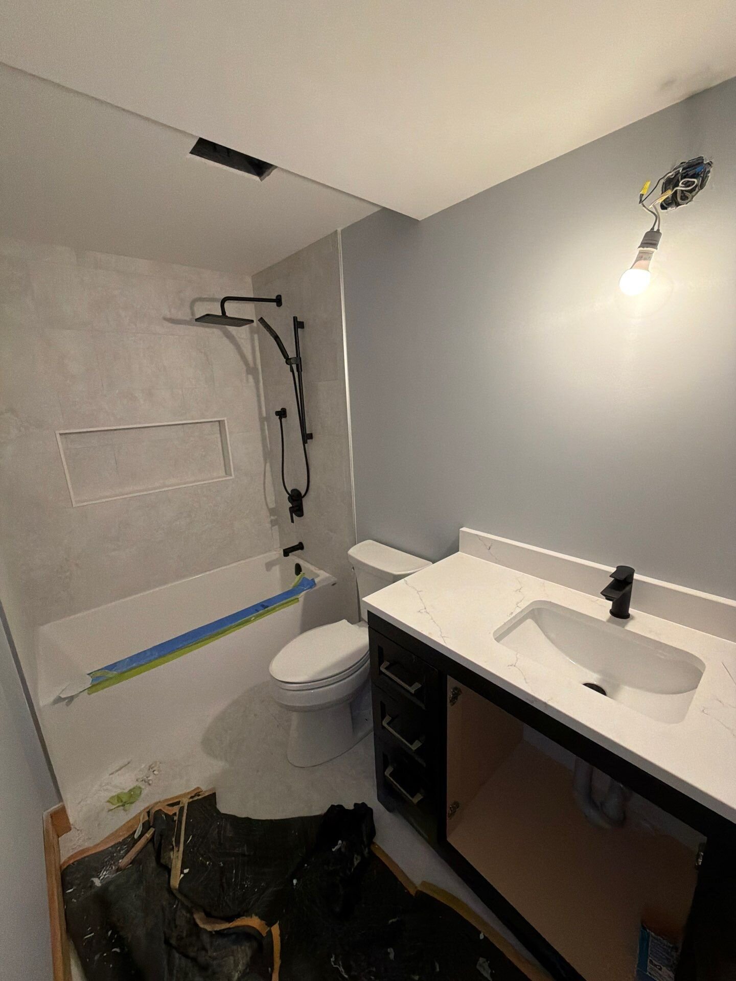 Finished bathroom in a new home | New home plumbing, Kitchener-Waterloo Finished bathroom in a new home with tub shower, toilet and vanity installed – new home plumbing, Einwechter Plumbing & Heating, Kitchener-Waterloo