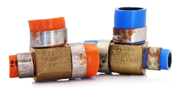 Corroded KITEC brass fittings | KITEC plumbing replacement, Kitchener-Waterloo Corroded KITEC brass fittings joining orange and blue pipe, stamped Kitec – KITEC plumbing replacement, Einwechter Plumbing & Heating, Kitchener-Waterloo