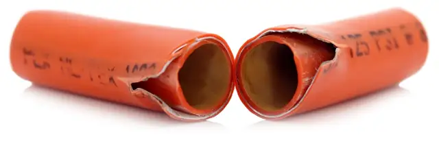 Burst KITEC pipe with torn aluminum layer | KITEC plumbing replacement, Kitchener-Waterloo Burst orange KITEC pipe showing the torn aluminum layer inside – KITEC plumbing replacement, Einwechter Plumbing & Heating, Kitchener-Waterloo