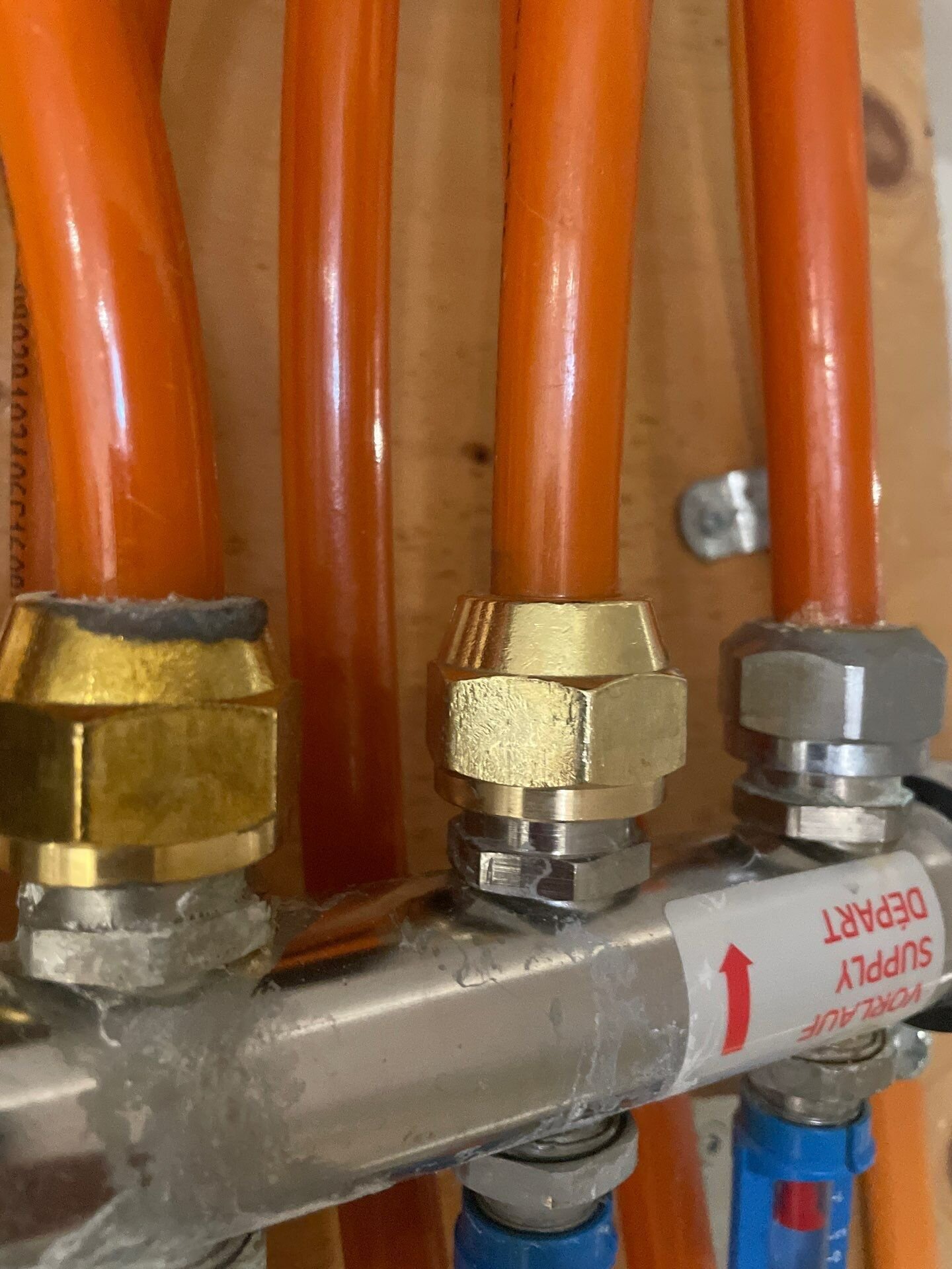 Orange KITEC pipes connected to brass fittings on a manifold | Kitec plumbing replacement, Kitchener-Waterloo Orange KITEC pipes connected to brass fittings on a manifold – kitec plumbing replacement, Einwechter Plumbing & Heating, Kitchener-Waterloo