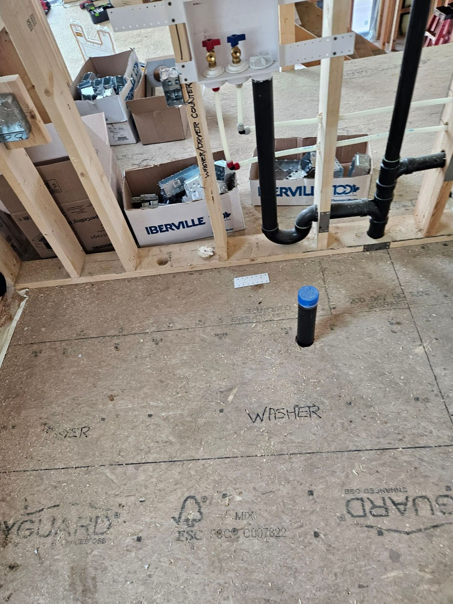 Laundry rough-in on a new home | New home plumbing, Kitchener-Waterloo Laundry rough-in on a new home: washer box with hot and cold valves, ABS drain and vent in the framing – new home plumbing, Einwechter Plumbing & Heating, Kitchener-Waterloo