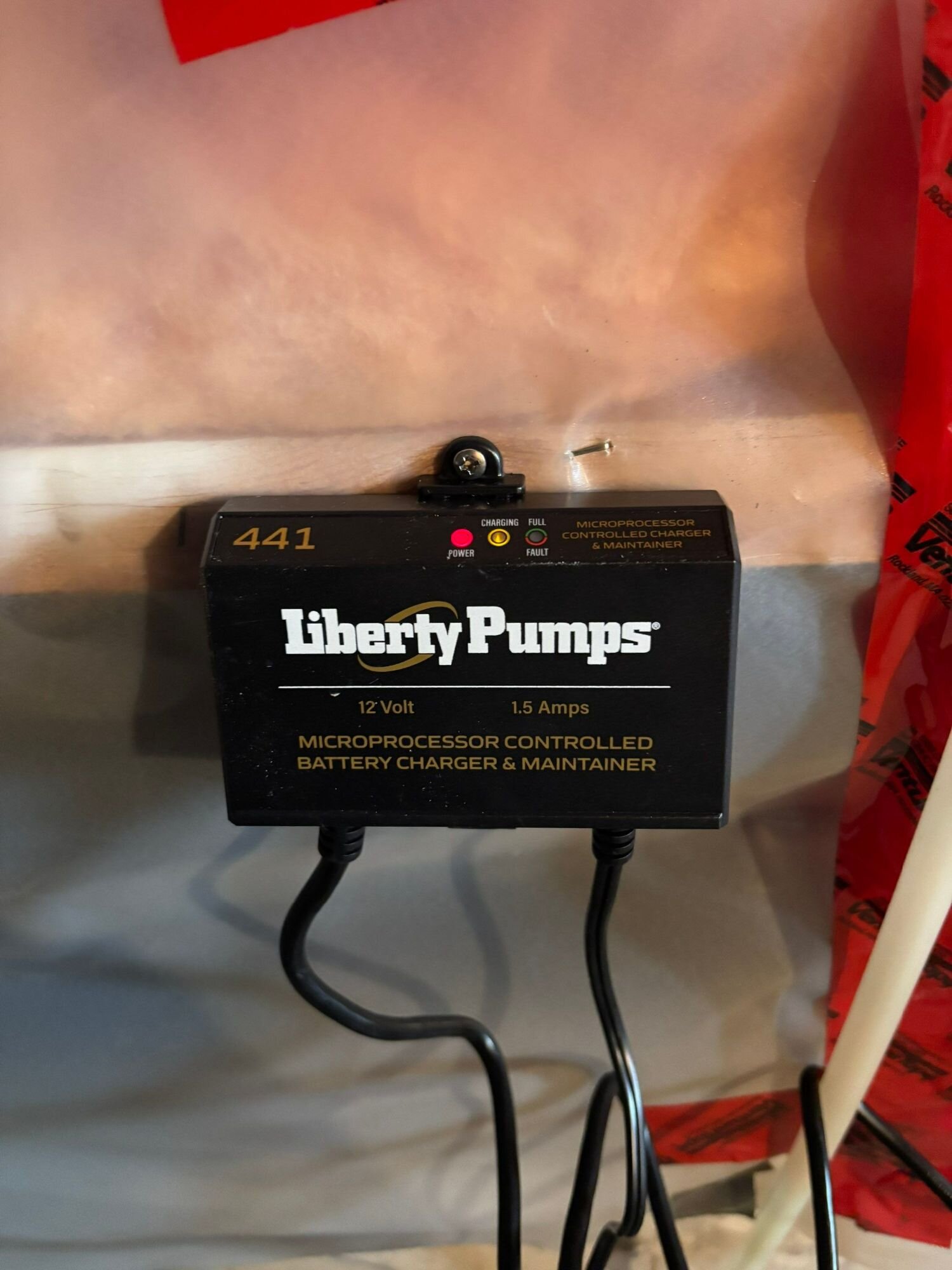 Liberty 441 battery backup controller | Sump pump installation, Kitchener-Waterloo Liberty Pumps 441 battery backup controller mounted on a basement wall, Einwechter Plumbing & Heating, Kitchener-Waterloo