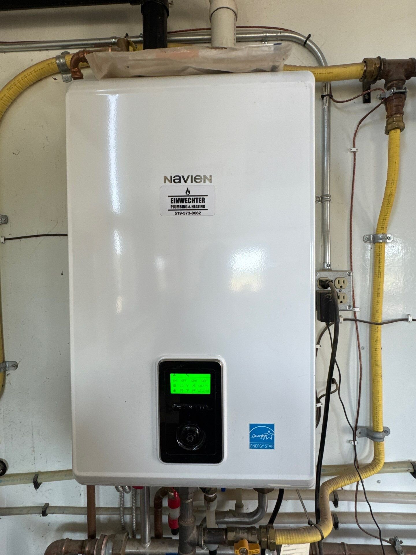 Combi boiler | Boiler replacement cost, Kitchener-Waterloo Combi boiler installed on a wall, Kitchener-Waterloo