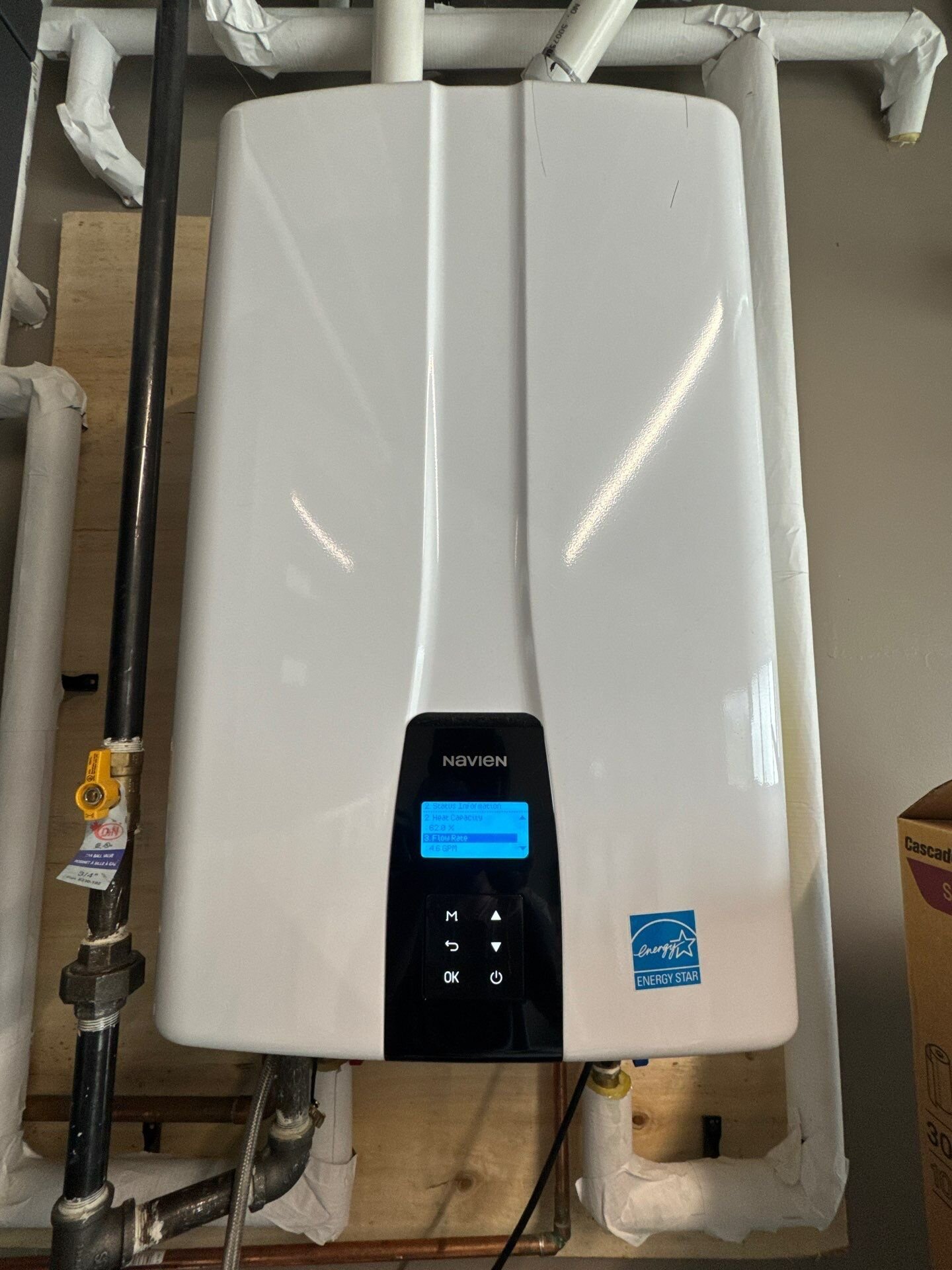 Tankless water heater installation, Waterloo Region and Wellington County Wall-mounted Navien tankless water heater installed by Einwechter Plumbing & Heating