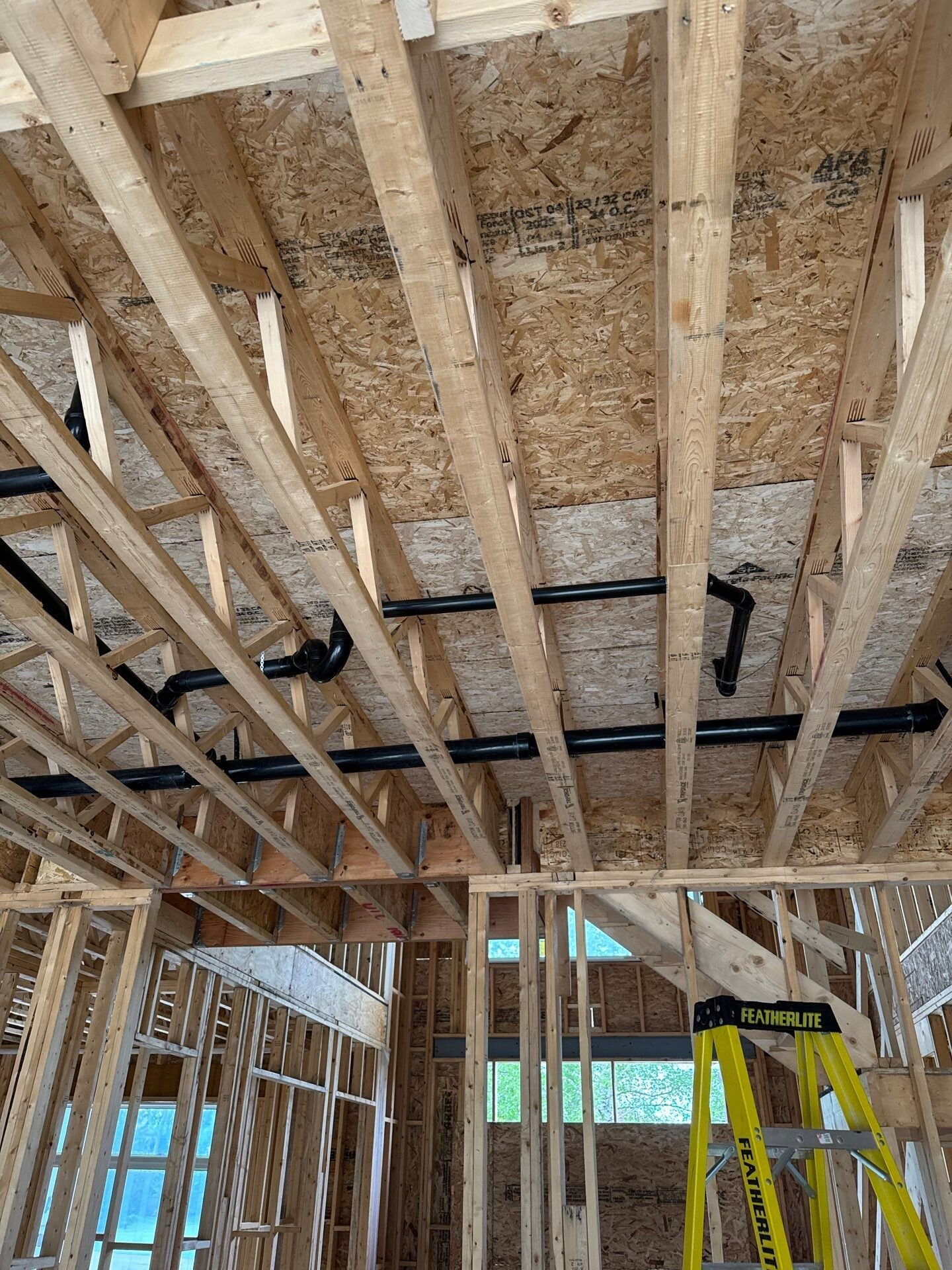 New-build ceiling with drain runs roughed in before drywall | New home plumbing, Kitchener-Waterloo New-build ceiling with drain runs roughed in before drywall – new home plumbing, Einwechter Plumbing & Heating, Kitchener-Waterloo