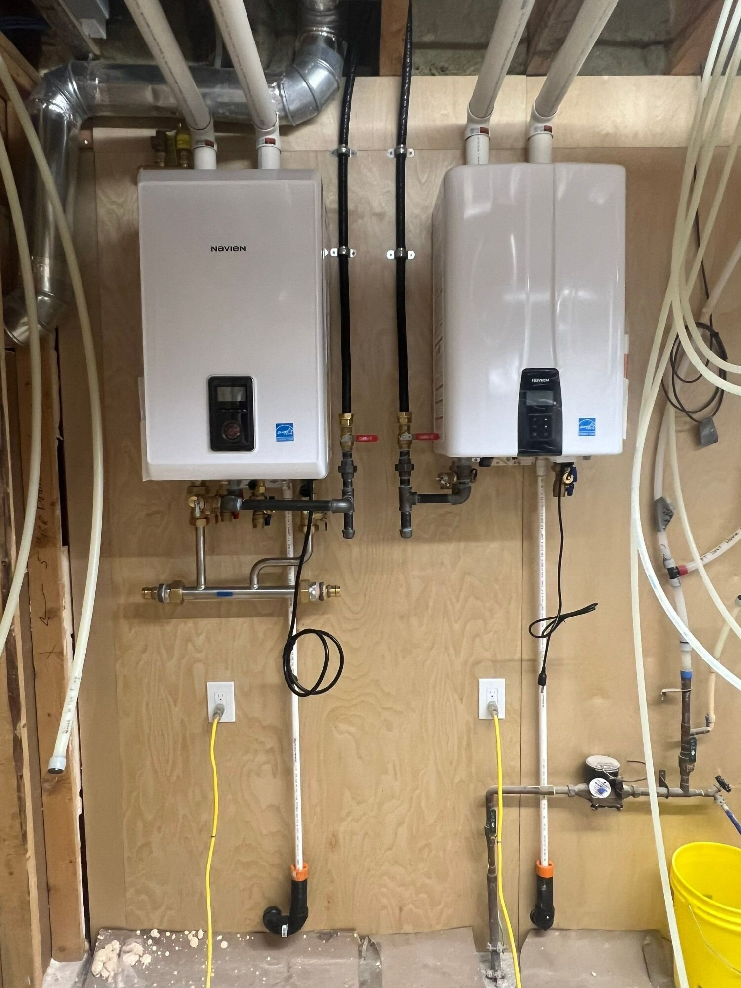 Finished mechanical room on a new home | New home plumbing, Kitchener-Waterloo Finished mechanical room on a new home: two wall-hung units, headers and PEX distribution – new home plumbing, Einwechter Plumbing & Heating, Kitchener-Waterloo