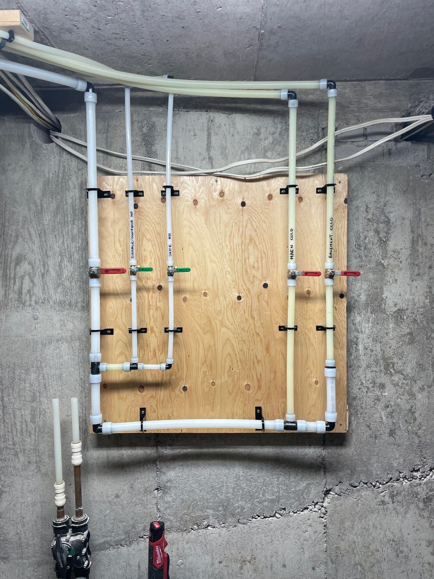 New PEX manifold after KITEC replacement | KITEC plumbing replacement, Kitchener-Waterloo New PEX water manifold board installed during a KITEC replacement by Einwechter Plumbing & Heating, Kitchener-Waterloo