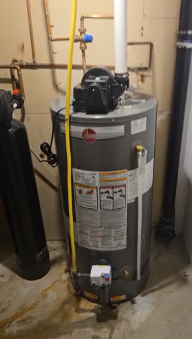 Water heater replacement in Kitchener-Waterloo by Einwechter Plumbing & Heating, New Dundee ON Rheem gas tank water heater installed by Einwechter Plumbing & Heating in a Kitchener-Waterloo home