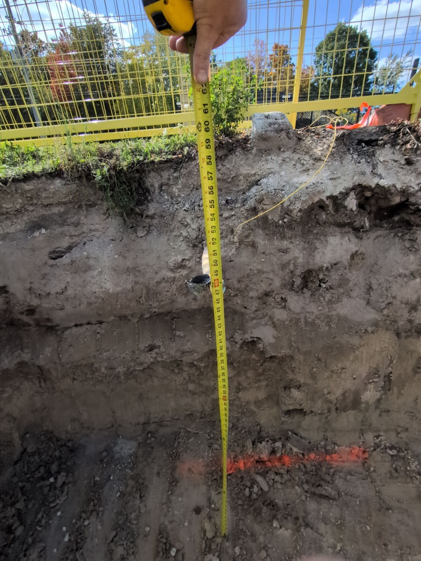 Measuring trench depth for a new sewer line – sewer and water line replacement, Einwechter Plumbing & Heating, Kitchener-Waterloo