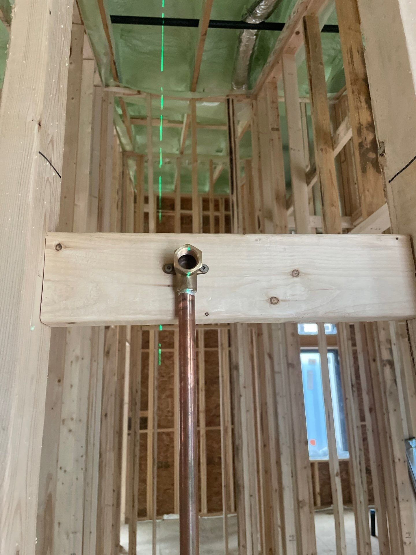 Copper shower head drop on blocking | New home plumbing, Kitchener-Waterloo Copper shower head drop fastened to wood blocking in the framing of a new home – new home plumbing, Einwechter Plumbing & Heating, Kitchener-Waterloo