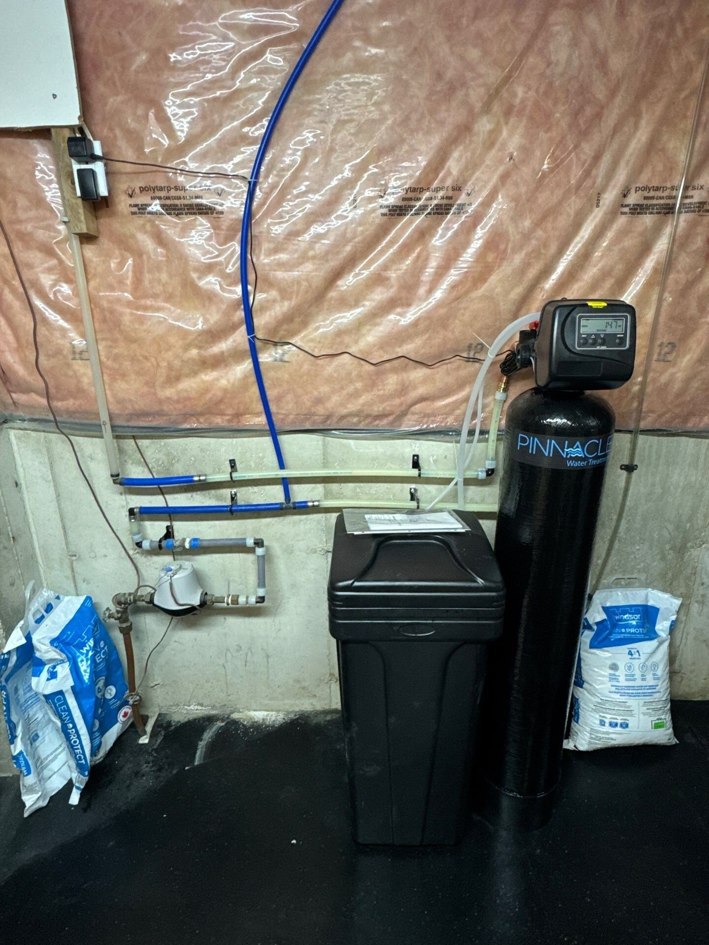Water softener and brine tank installed in a basement by Einwechter Plumbing &am | Whole-home water filtration, Kitchener-Waterloo Water softener and brine tank installed in a basement by Einwechter Plumbing & Heating, Kitchener-Waterloo