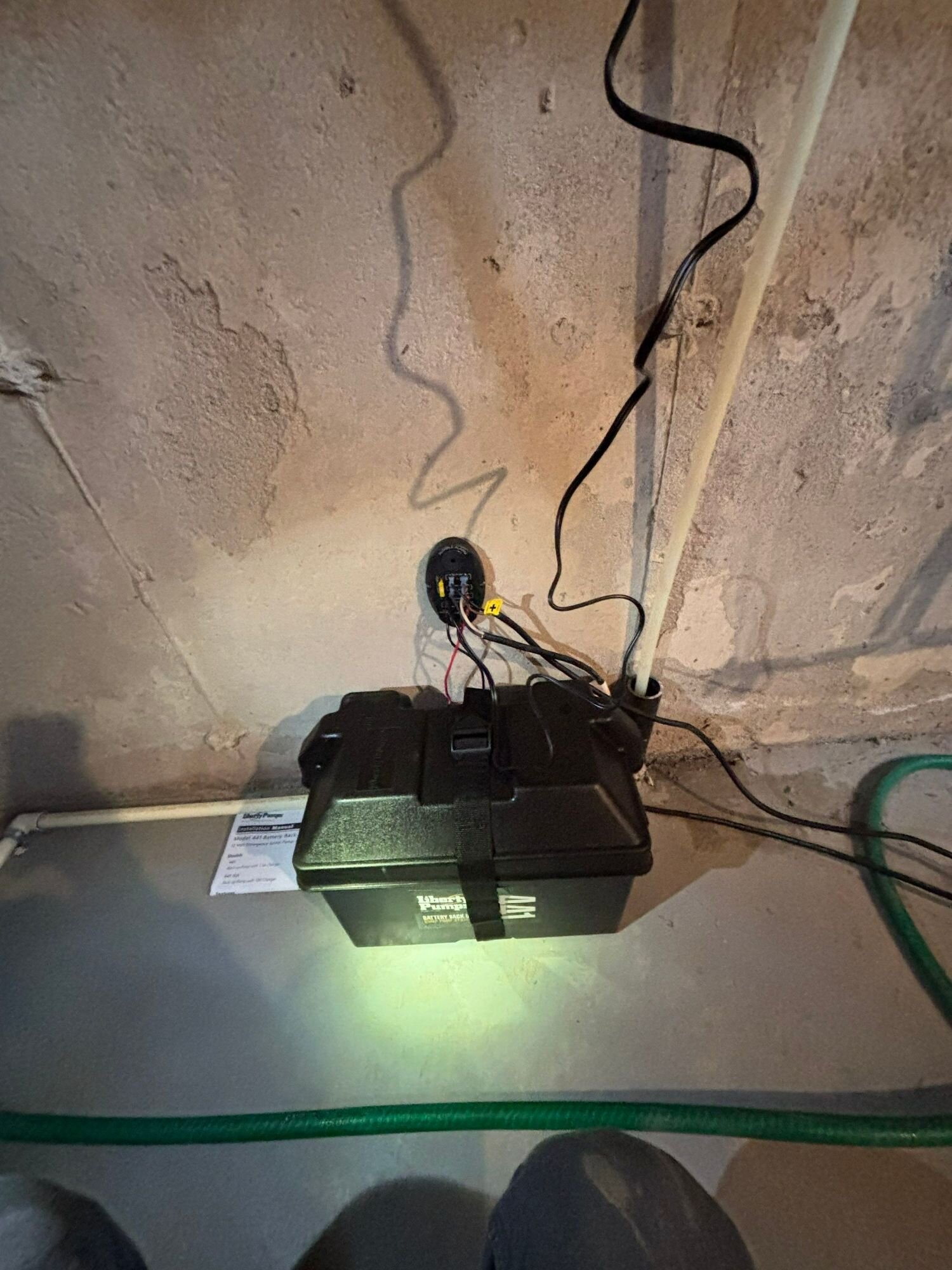 Sump backup battery box | Sump pump installation, Kitchener-Waterloo Sealed battery box for a sump pump battery backup on a basement floor, Einwechter Plumbing & Heating, Kitchener-Waterloo