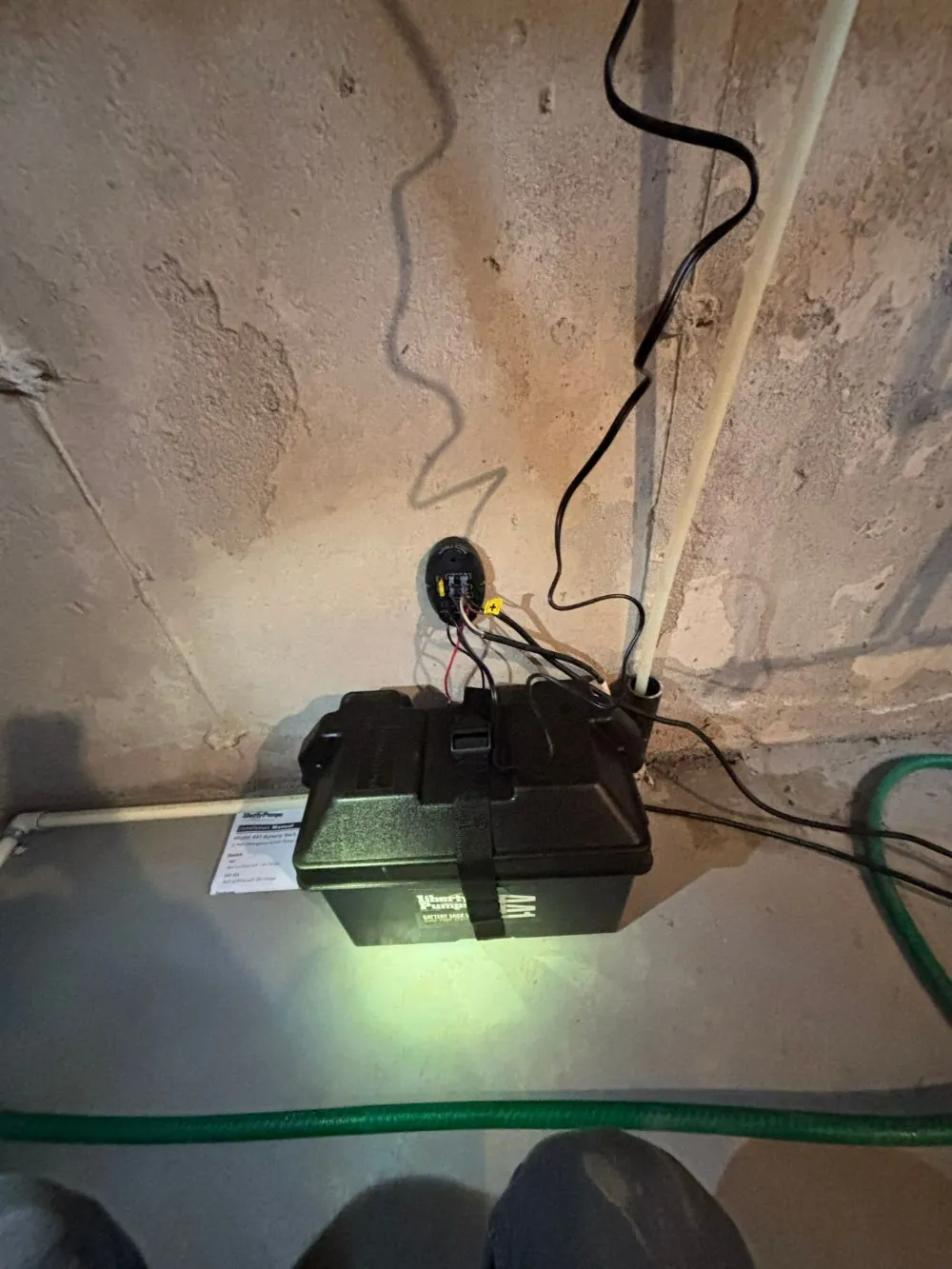 Sump pump battery backup box beside a sump pit, Kitchener-Waterloo