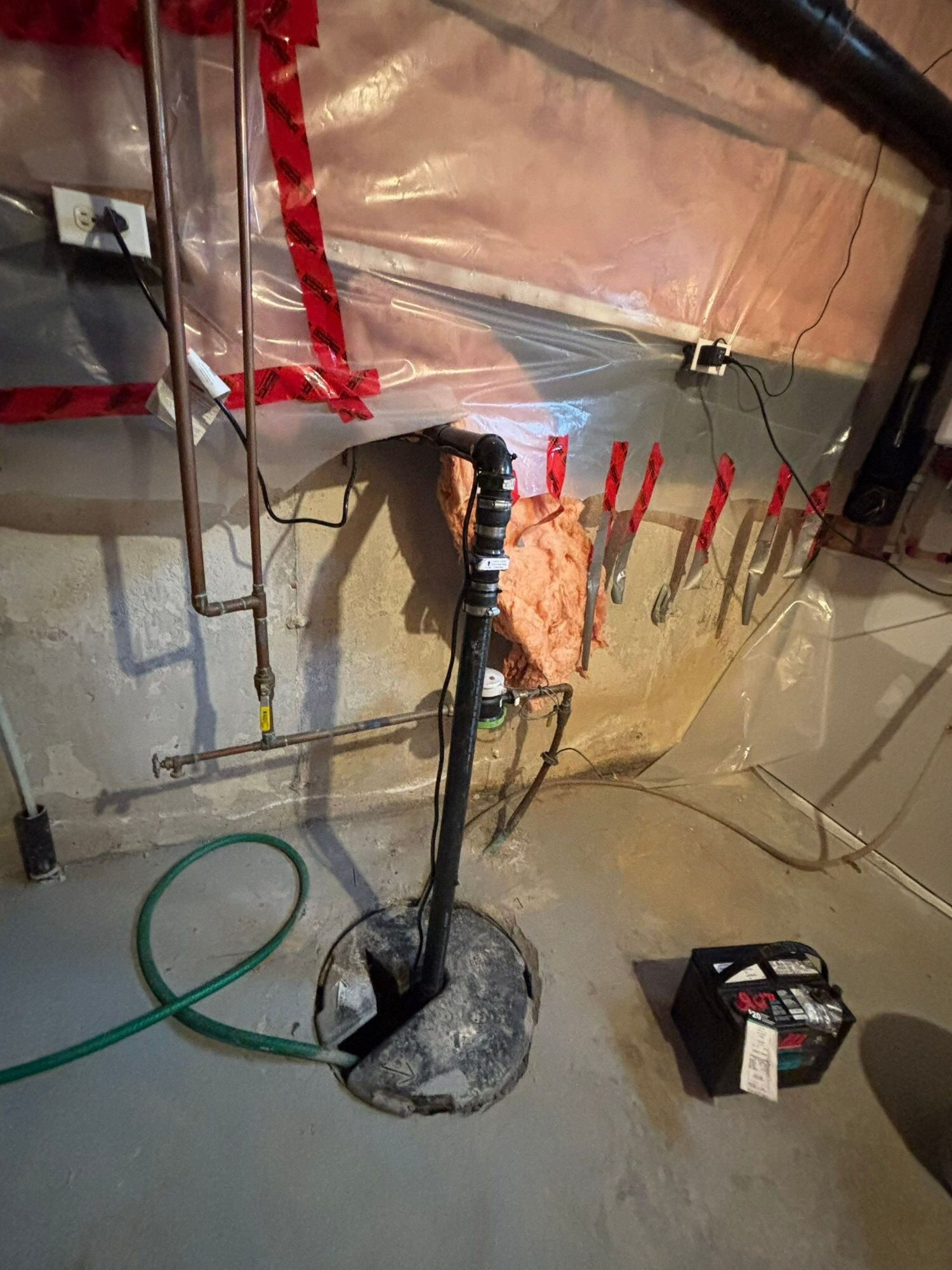 New sump pump installed in a basement pit, Kitchener-Waterloo