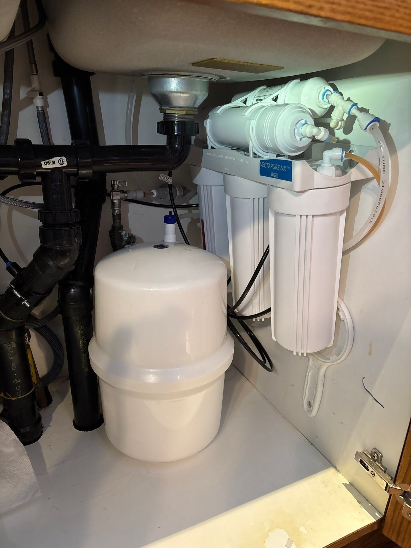 Under-sink reverse osmosis drinking water system with filters and storage tank, | Whole-home water filtration, Kitchener-Waterloo Under-sink reverse osmosis drinking water system with filters and storage tank, installed by Einwechter Plumbing & Heating, Kitchener-Waterloo